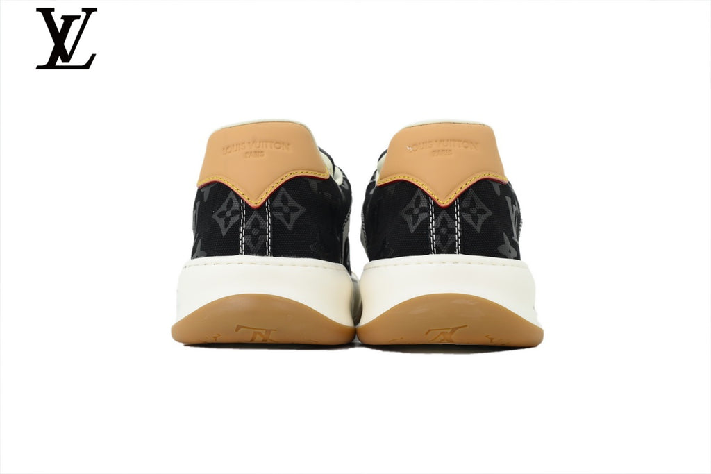 Louis Vuitton Low Top Sneaker in Black Monogram Canvas with White Leather Trim and Gum Sole