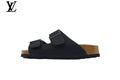 Birkenstock Slide Sandal in Black with Double Buckle and Cork Footbed